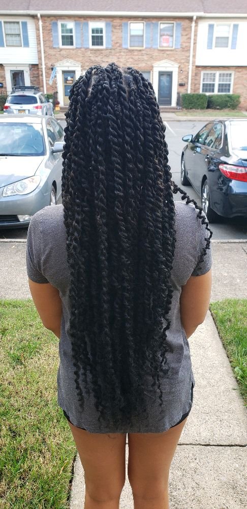 Passion twists in black, extra long, back view outdoors