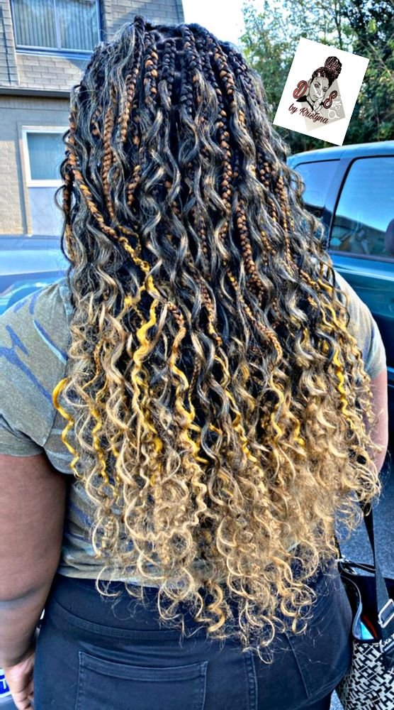 Boho braids with long curly ends in a black, brown and blonde blend, back view