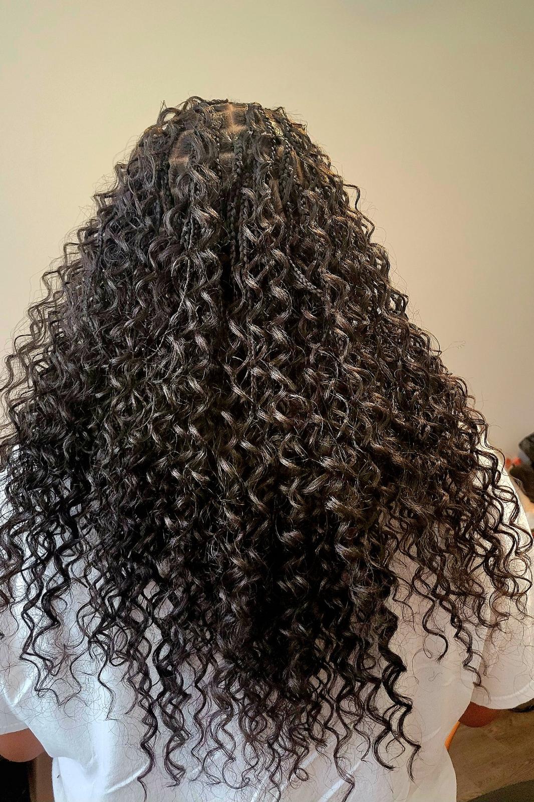 Miracle knot braids in dark brown with loose glossy curls, back view